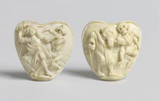 Heart-shaped plaques (fragments of scabbards)