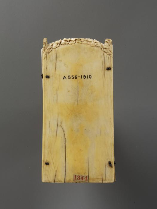 Rounded-top triptych (originally gabled triptych), 2 registers, 2 arches across and 3 arches across (frise d'arcatures; colonnettes) (Back, closed)