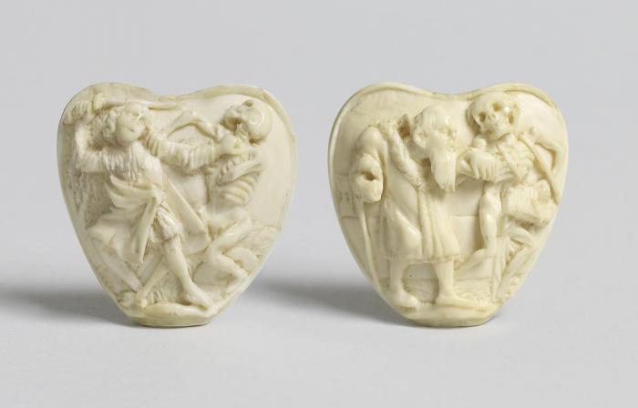 Heart-shaped plaques (fragments of scabbards)