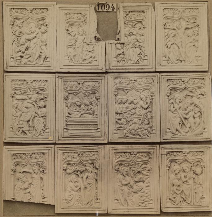 12 panels (fragments of a box), 1 register, 1 ogee arch across (plaquettes) (Group, front)