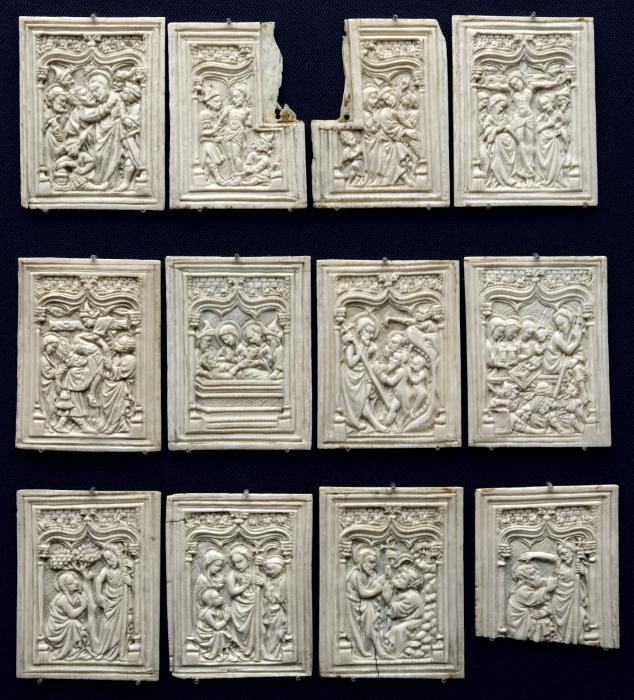 12 panels (fragments of a box), 1 register, 1 ogee arch across (plaquettes) (Group, front)